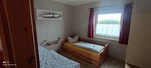 Schlafraum mit 2 Einzelbetten + 1 Auszugsbett - Bild 13: Ferienhof im Ostseebad Rerik- Ferienhaus (Doppelhaus)