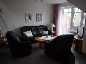 Gemütlicher Wohnbereich mit Balkon und Blick zum Meer - Bild 1: Nordseeküste-Schillig, Appartmenthaus-Boje Wohnung 15