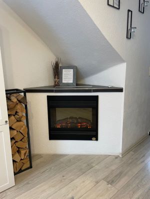 Ein Elektro-Kamin sorgt für pure Gemütlichkeit am Abend nach einem erlebnisreichen Tag - Bild 4: TOP Ferienwohnung "AussichtsReich" in Hahnenklee für 2 - 3 Pers. und Hund